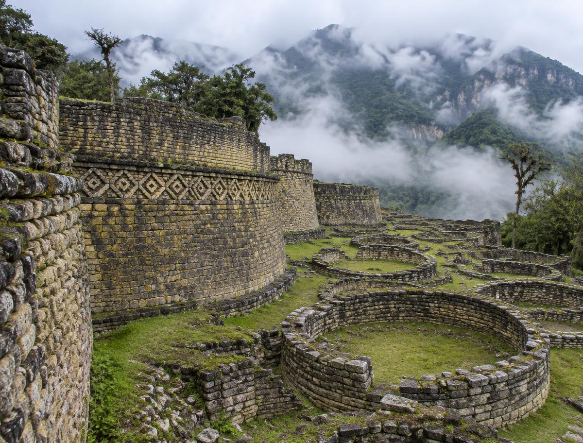 Round stone buildings and walls of Kuélap in the cloud forest